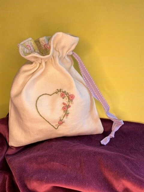 Embroidered heart drawstring bag