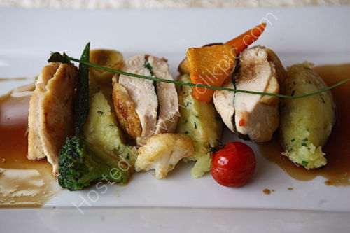 Main course of guinea Fowl and roasted vegetables at the Auberge de la Source, southern Normandy.
