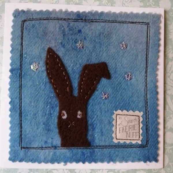 Mixed Media Dark Brown Hare and Snowflakes Greetings Card