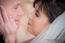 Cullen-Bay-Hotel-Wedding-Photography-010 Bride and groom in romantic pose looking into each others eyes.