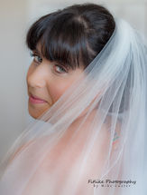 Cullen-Bay-Hotel-Wedding-Photography-02 The bride looking back through her veil.