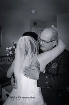 Cullen-Bay-Hotel-Wedding-Photography-03 Bride and Dad embrace.