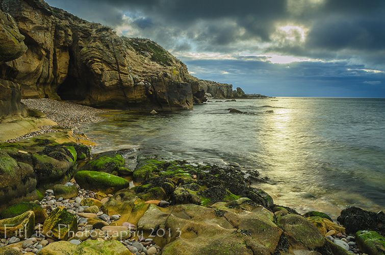A sunset landscape photograph taken at Cummingston Beach, Moray