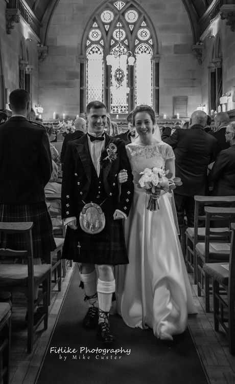 The bride and groom leaving the church for the first time as man and wife.