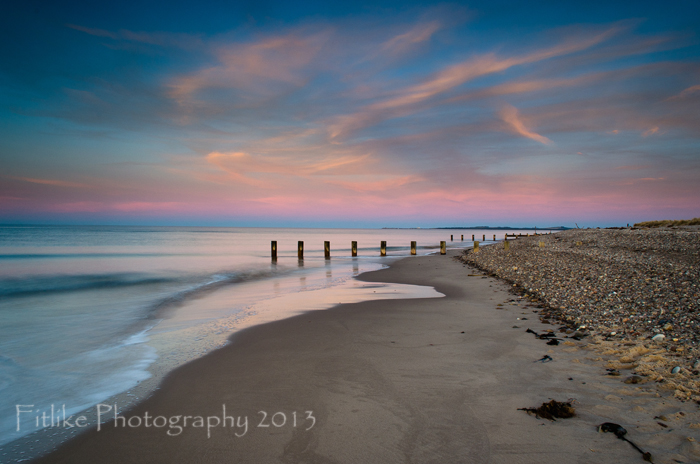 A sunset photograph at Findhorn Beach, Moray. The soft pastel blues and pinks in the skyas I'm photographing to the east