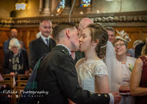 Glen-Mhor-Hotel-Inverness-Wedding-Photography-005 Bride and Groom first kiss. RNI Chapel, Inverness.