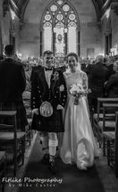 Glen-Mhor-Hotel-Inverness-Wedding-Photography-006 Bride and Groom walking down the aisle.