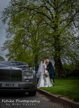 Glen-Mhor-Hotel-Inverness-Wedding-Photography-007 Bride and Groom photographed with their wedding car. A Rolls Royce Phantom.
