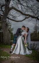 Glen-Mhor-Hotel-Inverness-Wedding-Photography-008 The bride and groom doing the dip pose.