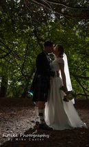 Glen-Mhor-Hotel-Inverness-Wedding-Photography-010 Bride and groom lit with off camera flash from behind.