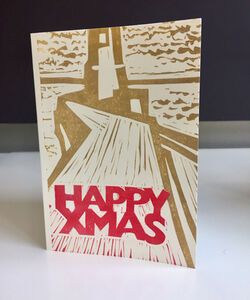 Berwick lighthouse in ochre and red.