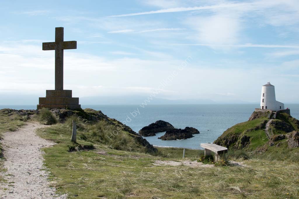 Cross and Lighthouse Llanddwyn Island Anglesey