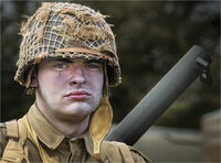 SOLDIER CARRYING WEAPON