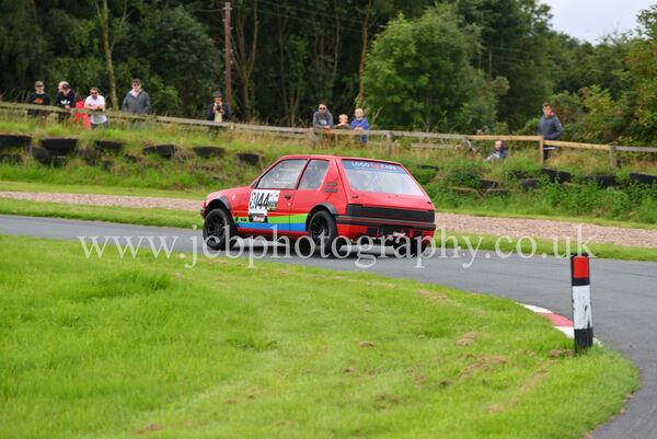 Peugeot 205 GTi driven by Adrian Crawley