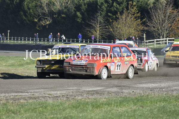 Yellow Ford Escort driven by Brian Hardman and the Ford Fiesta driven by Michael Grant