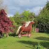Unicorn in garden - far