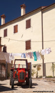 Red tractor and washing line, Draguc