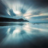 Racing clouds reflected