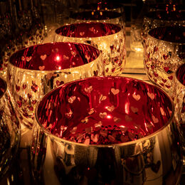 LOVING CUPS: A riot of gold and reds not forgetting the hearts. Well seen composed and taken. Eyes held to three central cups. However, can see the photographer in the reflections.