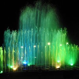 LIGHT FOUNTAINS 2: Stands out against the black background. Top of fountains nicely blurred. Perhaps take out the light patches to bottom left?