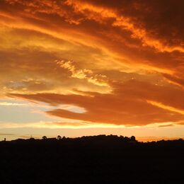 STORMY SKIES: Good skyscape with intense colour and useful to have land at base to ground the picture but perhaps too much black. Do need to see shape of horizon but could crop a little from the bottom.