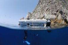 Entering the water above the wreck of the minesweeper HMS Regulus