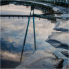 Reflections of suspension bridge over the river Lune