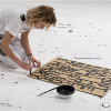 Artist painting a selected slogan