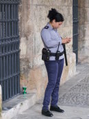 Cuban Police Woman with Gun & Painted Nails!, Plaza Armas, Havana