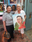 Artist Martalena with painting we bought, Havana