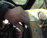 Hand on steering wheel