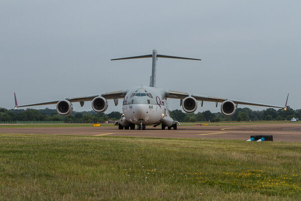 A Qatari Airlines liveried C17 Globemaster leaving the runway at Fairford. Qatari C17 Globemaster leaves Fairford's runway.