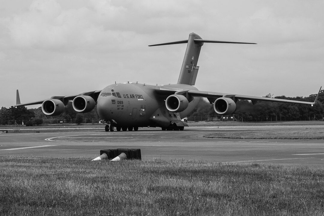 A black and white image of an American C17 Globemaster leaving the runway at Fairford