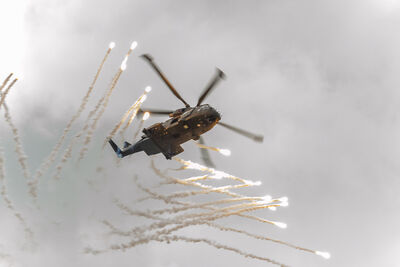 Royal Navy Merlin pops flares at Airday. Royal Navy Merlin pops flares.