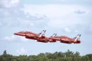 Three Red Arrows jets climb away from Fairford. Red Arrows