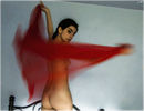 She dances on her bed.