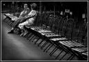 19 chairs and two old ladies. Glyn Davies Portrait