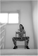 Girl in a stairwell.