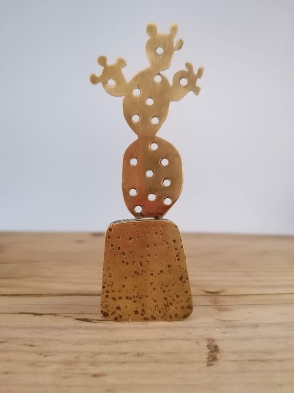 Kerry Day - Prickly Pear - Brass Sculpture standing next to a cactus in a yellow brown ceramic plant pot