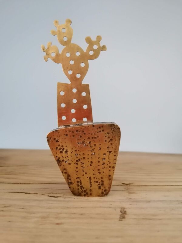 Kerry Day - Prickly Pear - Brass Sculpture standing next to a cactus in a yellow brown ceramic plant pot