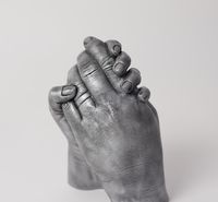 Two people holding hands