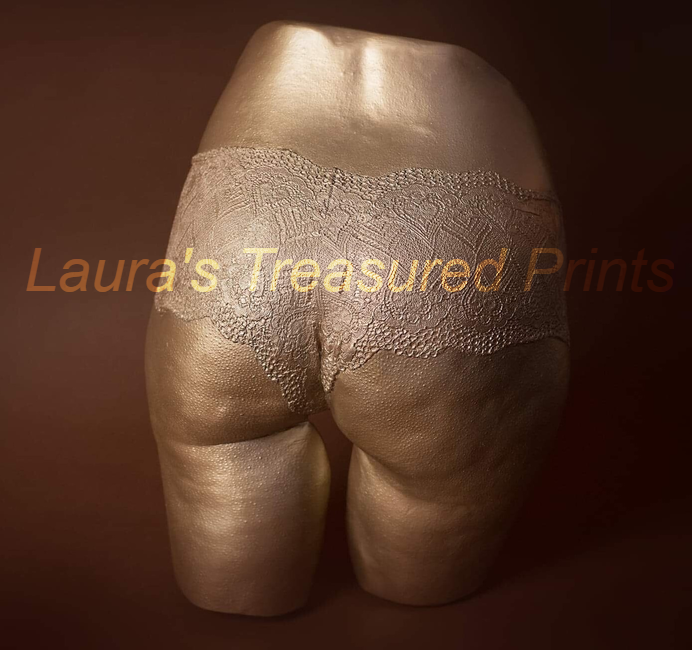 Body cast of a ladies bottom in lacy knickers