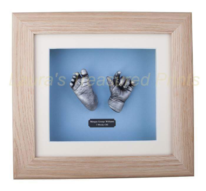 3D hand & foot newborn baby cast in solid oak frame.