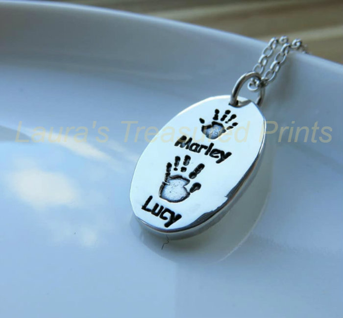 Foundry cast oval hand print pendant