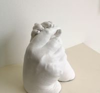 Grandmother & grandchild, holding hands cast finished in satin white