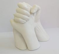 Family 3d hand cast finished in white.