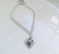 Looped heart silver charm