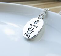 Foundry cast oval hand print pendant
