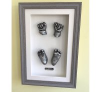 Four framed baby casts