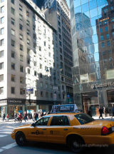New York - reflections and yellow cab on 5th Avenue